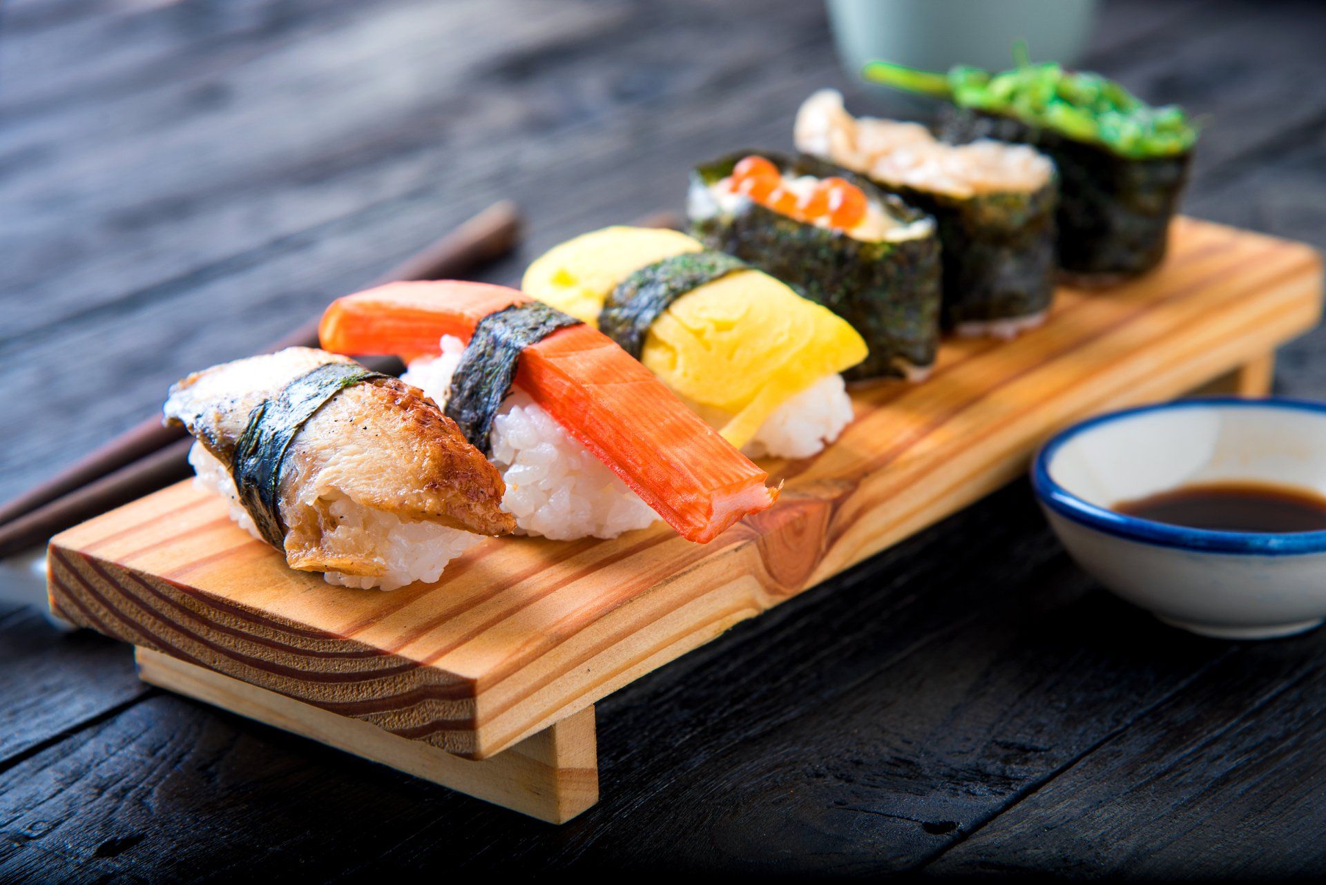 Nigiri arranged on a wooden serving board